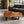 Laden Sie das Bild in den Galerie-Viewer, Couchtisch aus Akazie-Baumscheibe mit markanter Holzmaserung (Suarholz, ca. 107 x 90 x 43 cm, 8 cm starke Platte) und Naturkante, mittelgroßes Massivholz-Unikat für asiatisch inspiriertes Wohnzimmer, Loft oder Lounge in der Schweiz

