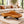 Charger l'image dans la galerie, Baumscheiben-Couchtisch aus 9 cm starker Akazien-Baumscheibe (114 × 110 × 43 cm) mit organischer Dreiecksform und echter Baumkante, massives Naturholz-Unikat als Wohnzimmertisch für L-Sofa, Lounge oder Design-Wohnzimmer in der Schweiz
