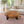 Laden Sie das Bild in den Galerie-Viewer, Couchtisch aus 9 cm starker Akazien-Baumscheibe (110 × 100 × 43 cm) mit rundlich-organischer Form, sanfter Einbuchtung, Naturriss und echter Baumkante, massives Naturholz-Unikat für Wohnzimmer mit L-Sofa, Familien-Lounge oder Meditations-Ecke in der Schweiz
