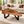 Charger l'image dans la galerie, Baumkante-Couchtisch aus massiver Akazien-Baumscheibe (109 × 105 × 43 cm) mit Delta/Tropfen-Form, Naturkante und Metallgestell, organisches Naturholz-Unikat als Salontisch für L-Sofa, Ecksofa oder Lounge in der Schweiz
