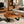 Laden Sie das Bild in den Galerie-Viewer, Dunkler Couchtisch aus Akazie-Baumscheibe (101 x 80 x 43 cm, 8 cm starke Platte) mit natürlicher Maserung, rustikal-elegantes Massivholz-Unikat für Wohn- und Kaffeetisch auf Holz- oder Marmorböden in der Schweiz
