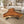 Laden Sie das Bild in den Galerie-Viewer, Dreieckiger Couchtisch aus Akazie-Baumscheibe, 110 x 110 x 43 cm, 8 cm starke Platte, rustikales Massivholz-Unikat für Wohnzimmer, Loft oder Lounge in der Schweiz
