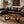 Load image into Gallery viewer, Freiform-Couchtisch aus massiver Akazien-Baumscheibe (120 x 60 x 43 cm, ca. 8 cm starke Platte) mit organischer Naturform, heller Baumkante und sichtbaren Jahresringen, Design-Unikat für stilvolle Wohnzimmer, Lounge oder Leseecke in der Schweiz
