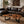 Load image into Gallery viewer, Freiform-Couchtisch aus massiver Akazien-Baumscheibe (120 x 60 x 43 cm, ca. 8 cm starke Platte) mit organischer Naturform, heller Baumkante und sichtbaren Jahresringen, Design-Unikat für stilvolle Wohnzimmer, Lounge oder Leseecke in der Schweiz
