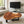 Laden Sie das Bild in den Galerie-Viewer, Couchtisch aus Akazie-Baumscheibe mit markanter Holzmaserung (Suarholz, ca. 107 x 90 x 43 cm, 8 cm starke Platte) und Naturkante, mittelgroßes Massivholz-Unikat für asiatisch inspiriertes Wohnzimmer, Loft oder Lounge in der Schweiz

