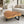 Laden Sie das Bild in den Galerie-Viewer, Akazie-Baumscheibe-Couchtisch (110 × 100 × 43 cm, 9 cm starke Platte) mit herzförmiger Wolken-Naturform, echter Baumkante und honigbrauner Maserung, Massivholz-Unikat für Wohnzimmer mit Ecksofa oder L-Sofa in der Schweiz
