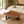 Laden Sie das Bild in den Galerie-Viewer, Baumscheiben-Couchtisch aus Akazie in Naturform (118 × 108 × 43 cm, 9 cm starke Platte) mit echter Baumkante und Metallgestell, massives Naturholz-Unikat für Wohnzimmer, Lounge oder Wintergarten in stilvollen Schweizer Wohnräumen
